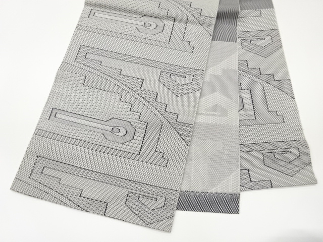  幾何学模様織出し名古屋帯